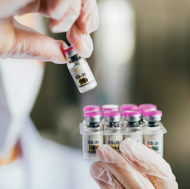 Thoroughbred Labs research vial held in a gloved hand